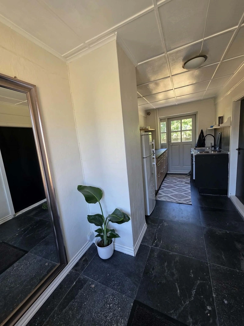 Entrance and kitchen area in Stillebo Apartment